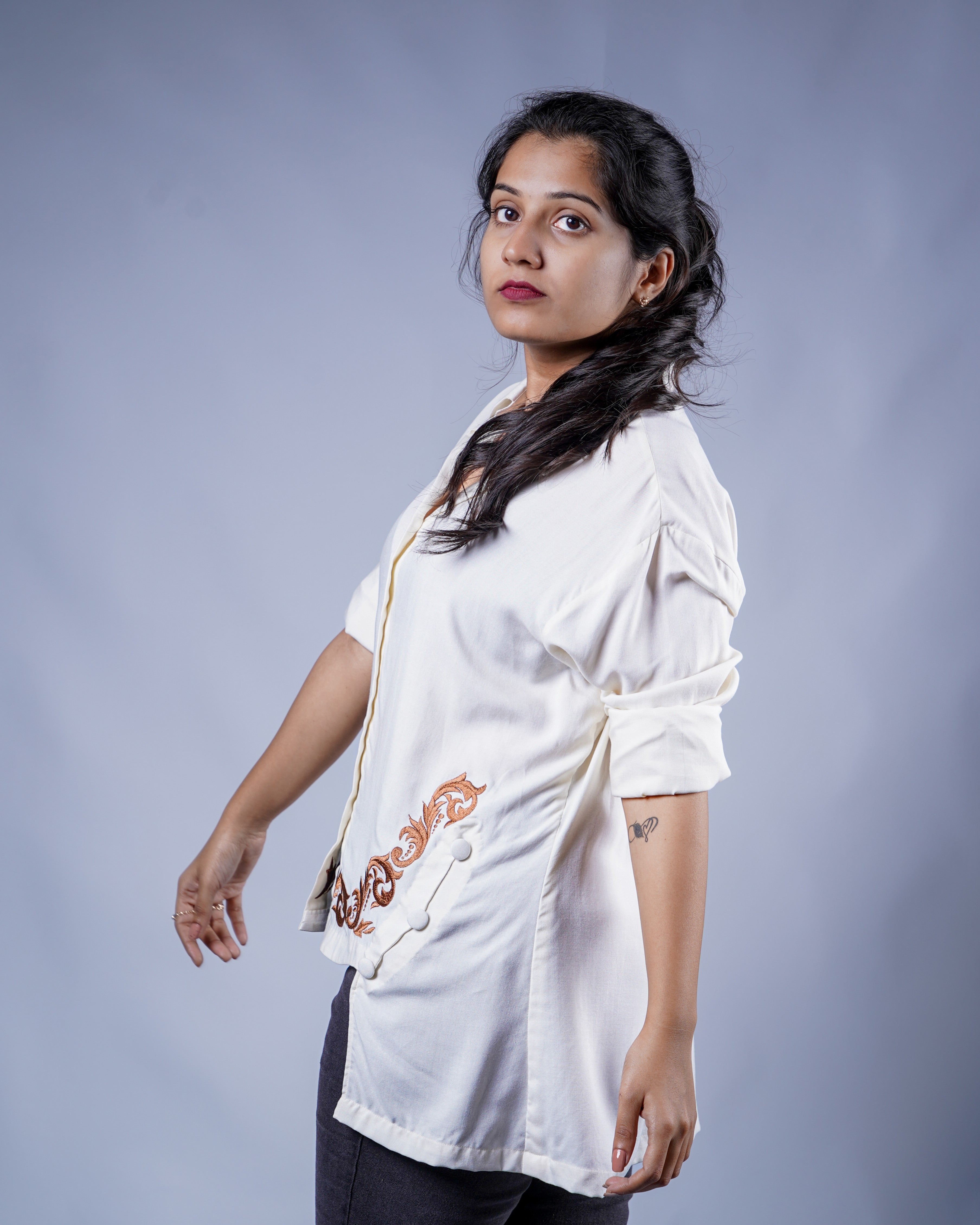 Trevae’s  Ivory  Rayon  High-Low  Shirt with  Curved  Embroidered Hem